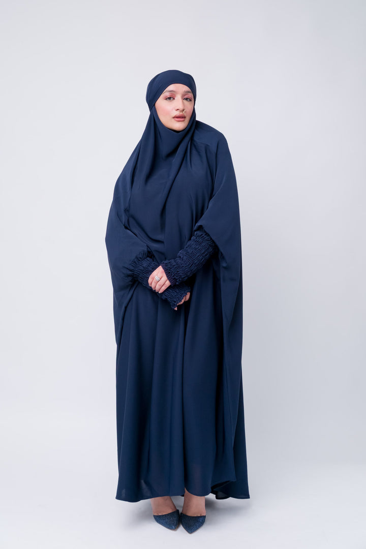 One-piece navy khimar jilbab with ruched sleeves, Islamic modest fashion for women and prayer.