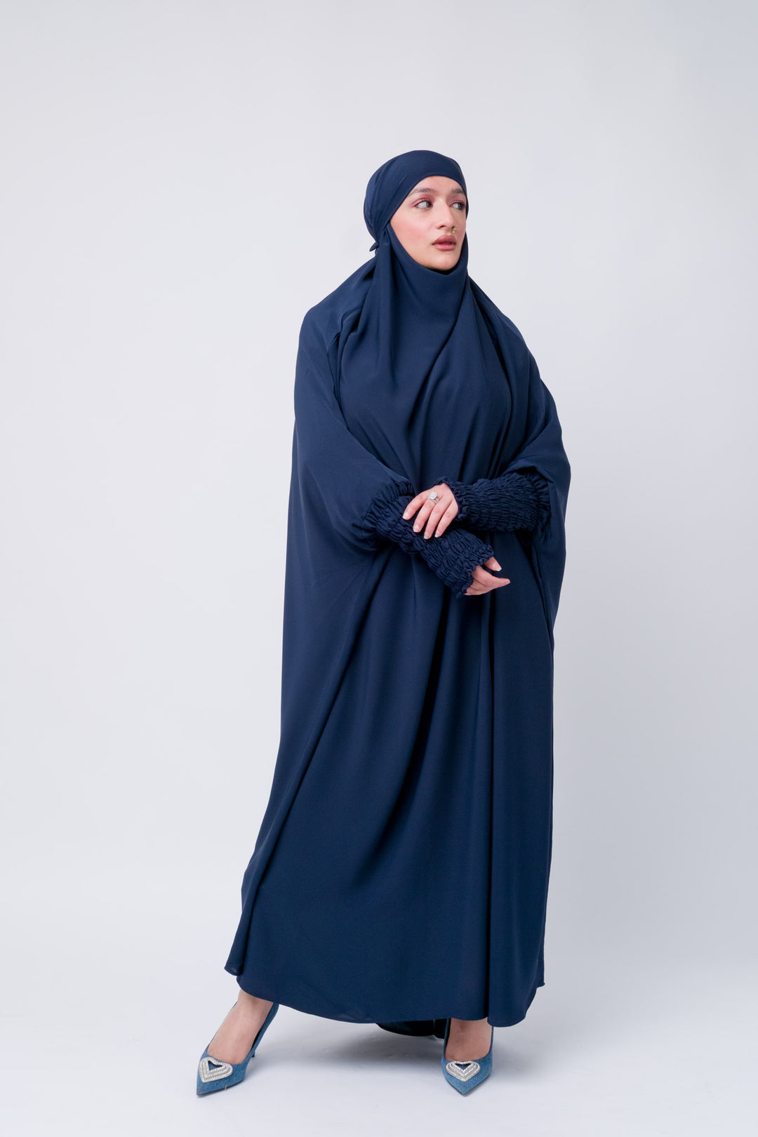 Navy blue khimar jilbab with ruched cuffs, modest full-length Islamic wear for Muslim women.