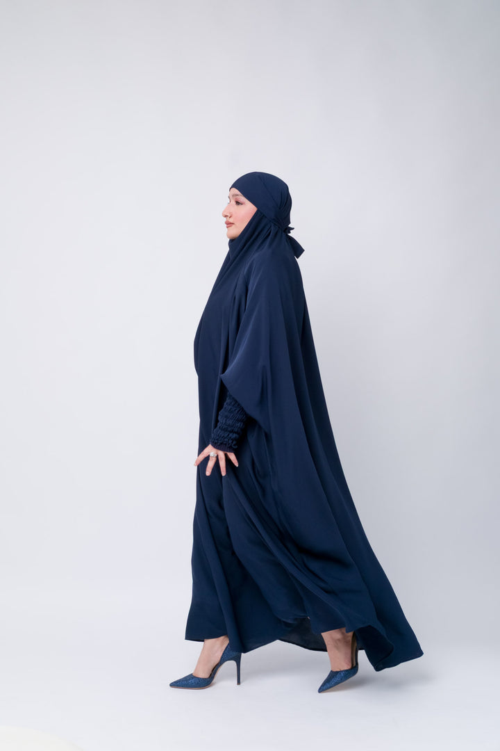 Full-length modest jilbab in dark navy blue with ruched elastic cuffs, Islamic outfit for women.