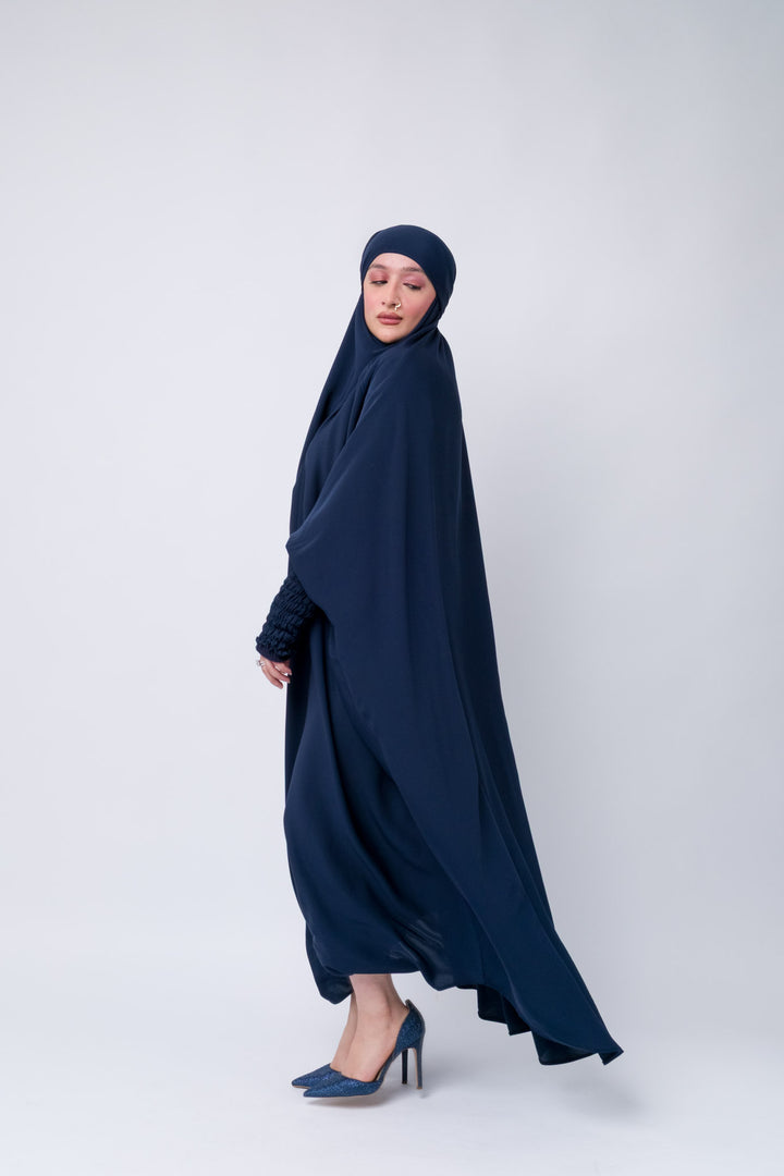 Stylish navy jilbab with full coverage and detailed cuff design, perfect for hijab and prayer.