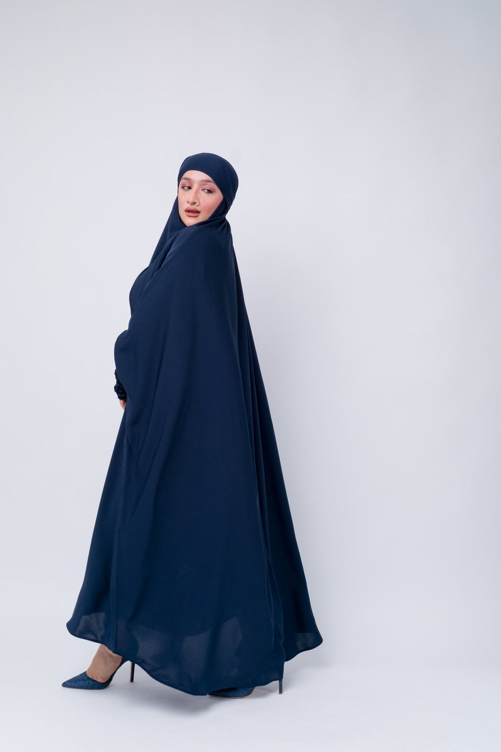 Elegant navy jilbab with smocked sleeves, full coverage khimar abaya for prayer and everyday wear.