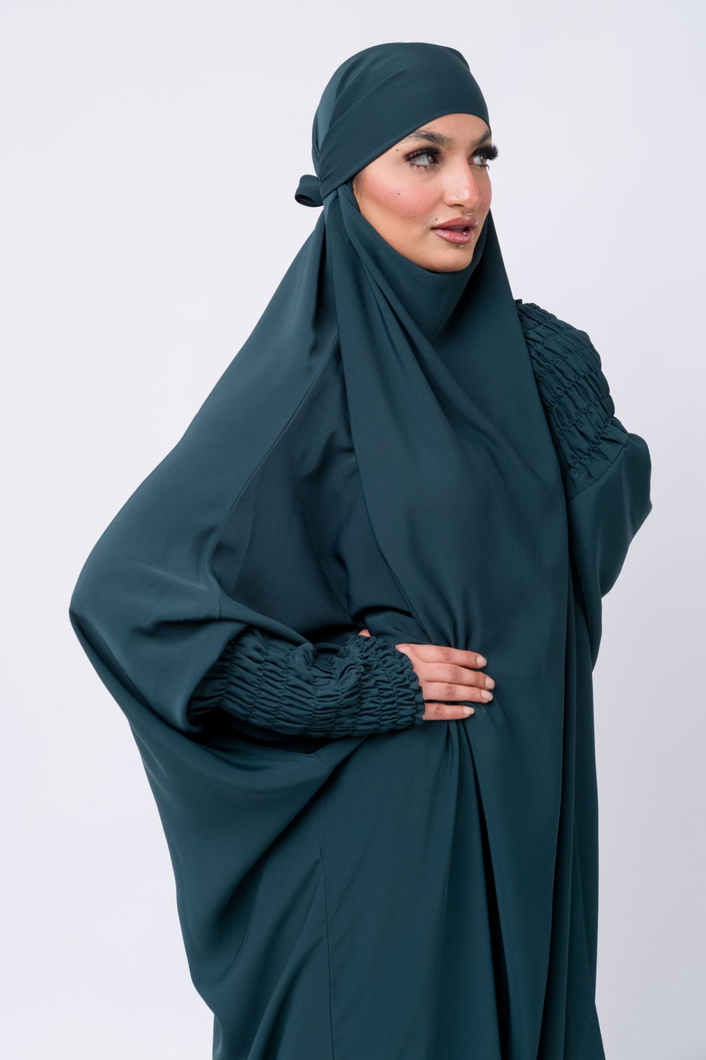 Elegant dark teal jilbab for women with ruched cuffs, perfect for Islamic prayer and modest fashion.
