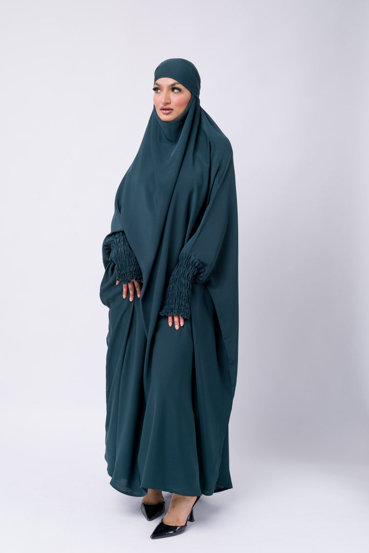 Islamic prayer khimar in dark teal with stylish smocked sleeve detail, full-length jilbab for women.