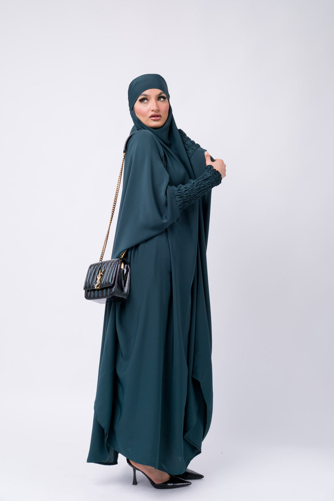 Dark teal khimar with smocked sleeves, modest Islamic outfit for Muslim women, full coverage prayer wear.