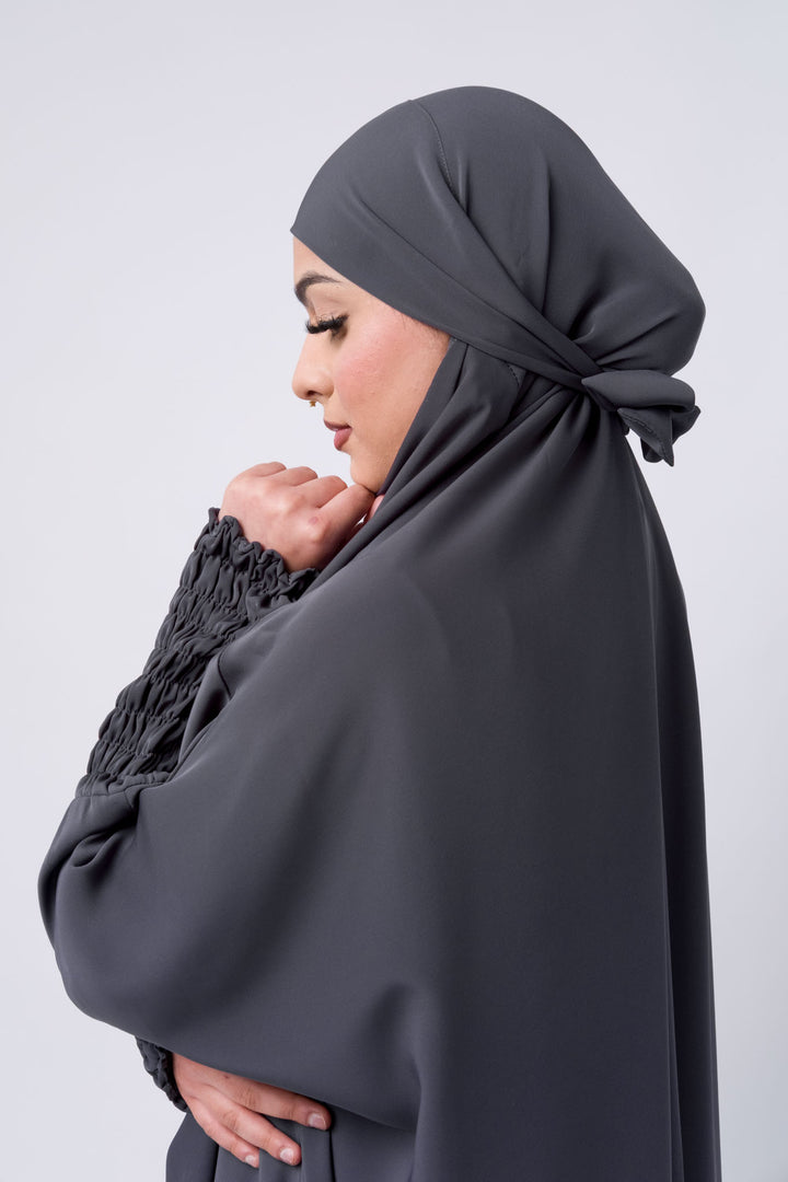 Comfortable grey one-piece khimar abaya with ruched cuffs, ideal for prayer and daily wear