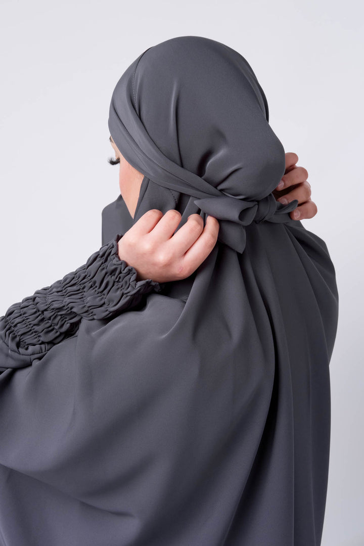 Islamic grey jilbab for women with long coverage and unique gathered sleeve cuffs. 