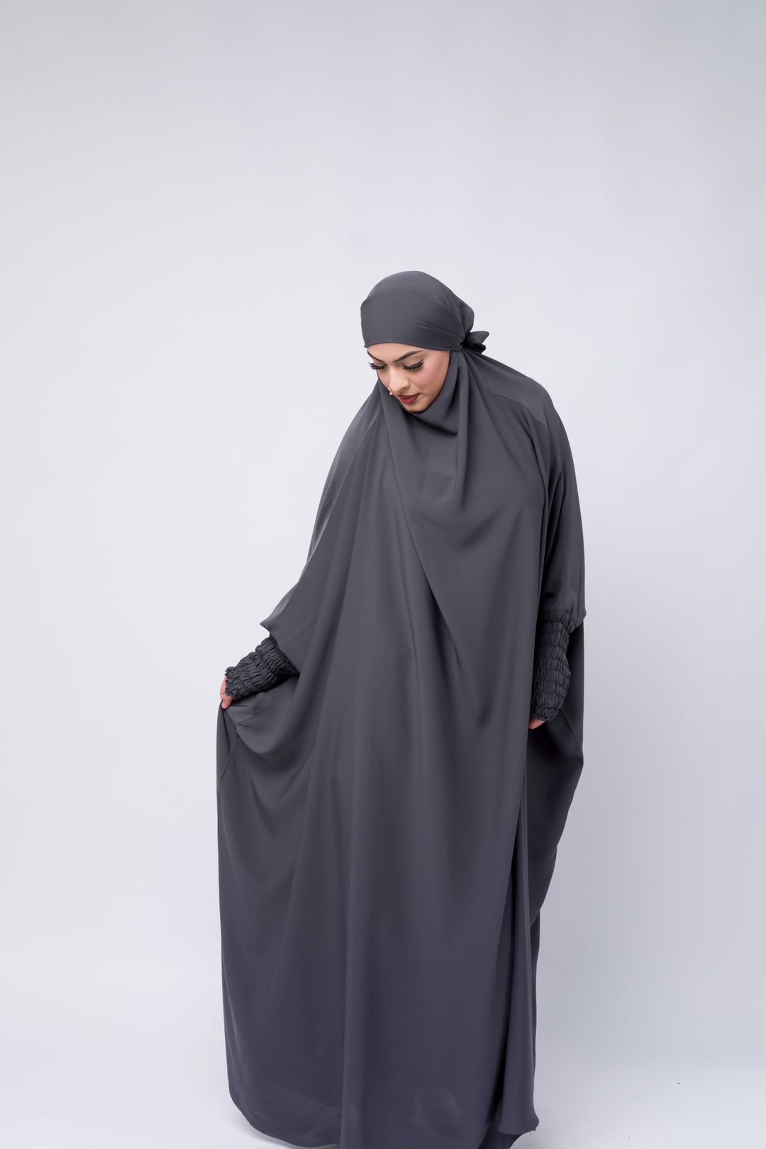 Modest full-length charcoal grey jilbab with loose and a relaxed fit, designed for comfort and elegance.