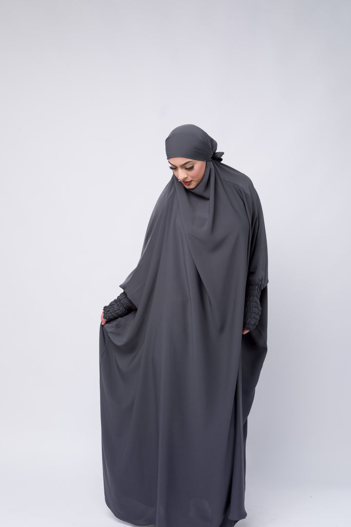Modest full-length charcoal grey jilbab with loose and a relaxed fit, designed for comfort and elegance.