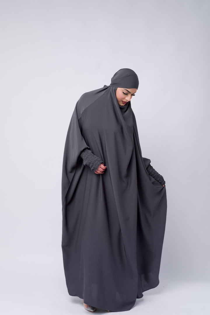 Modest full-length charcoal grey jilbab with loose and a relaxed fit, designed for comfort and elegance.