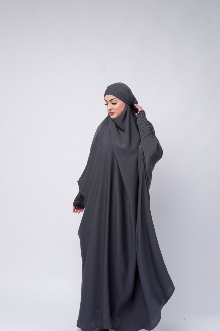 Chic full-length grey khimar for women, Islamic modest wear with smocked sleeve detailing.