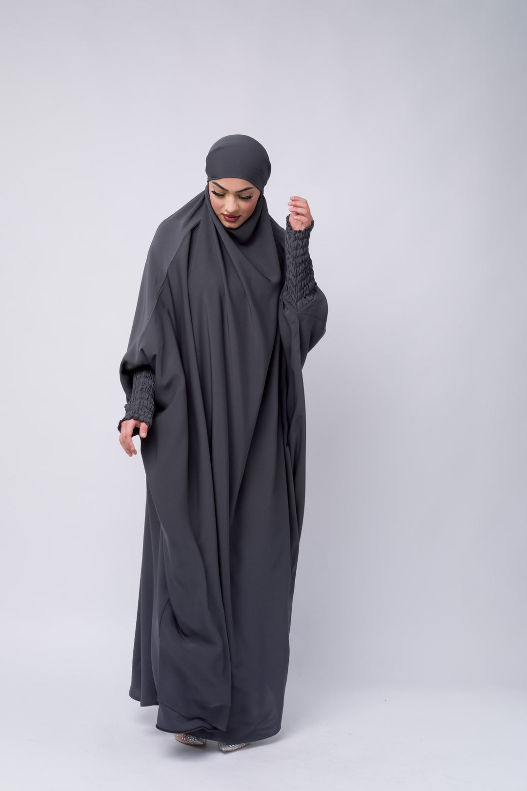 Grey modest khimar with long coverage and smocked sleeves, perfect Islamic clothing for women.
