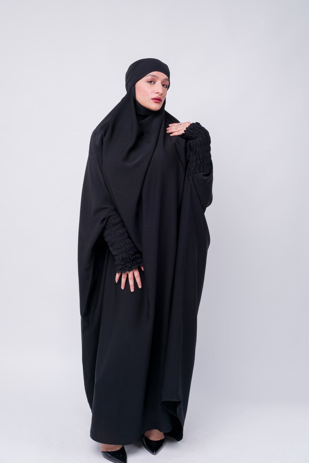 Elegant full-length black khimar abaya with elastic ruched cuffs, perfect for modest Islamic clothing needs.