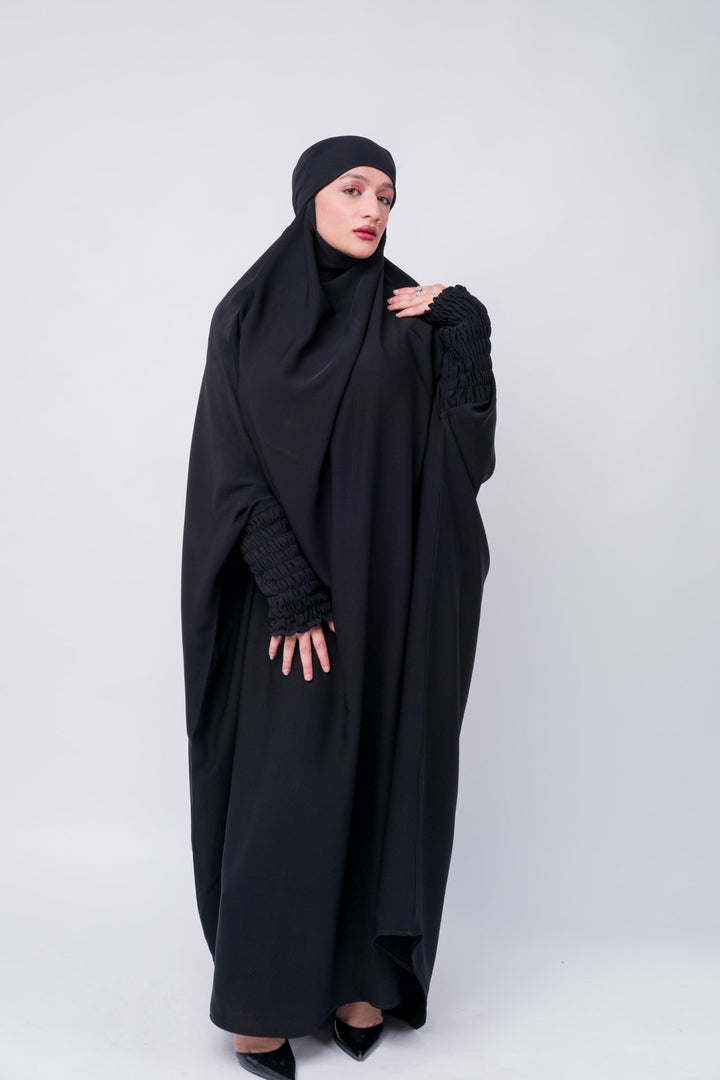 Elegant full-length black khimar abaya with elastic ruched cuffs, perfect for modest Islamic clothing needs.