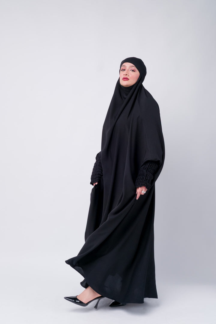 Black abaya khimar with comfortable batwing design and full coverage, perfect for prayer and daily modest wear.