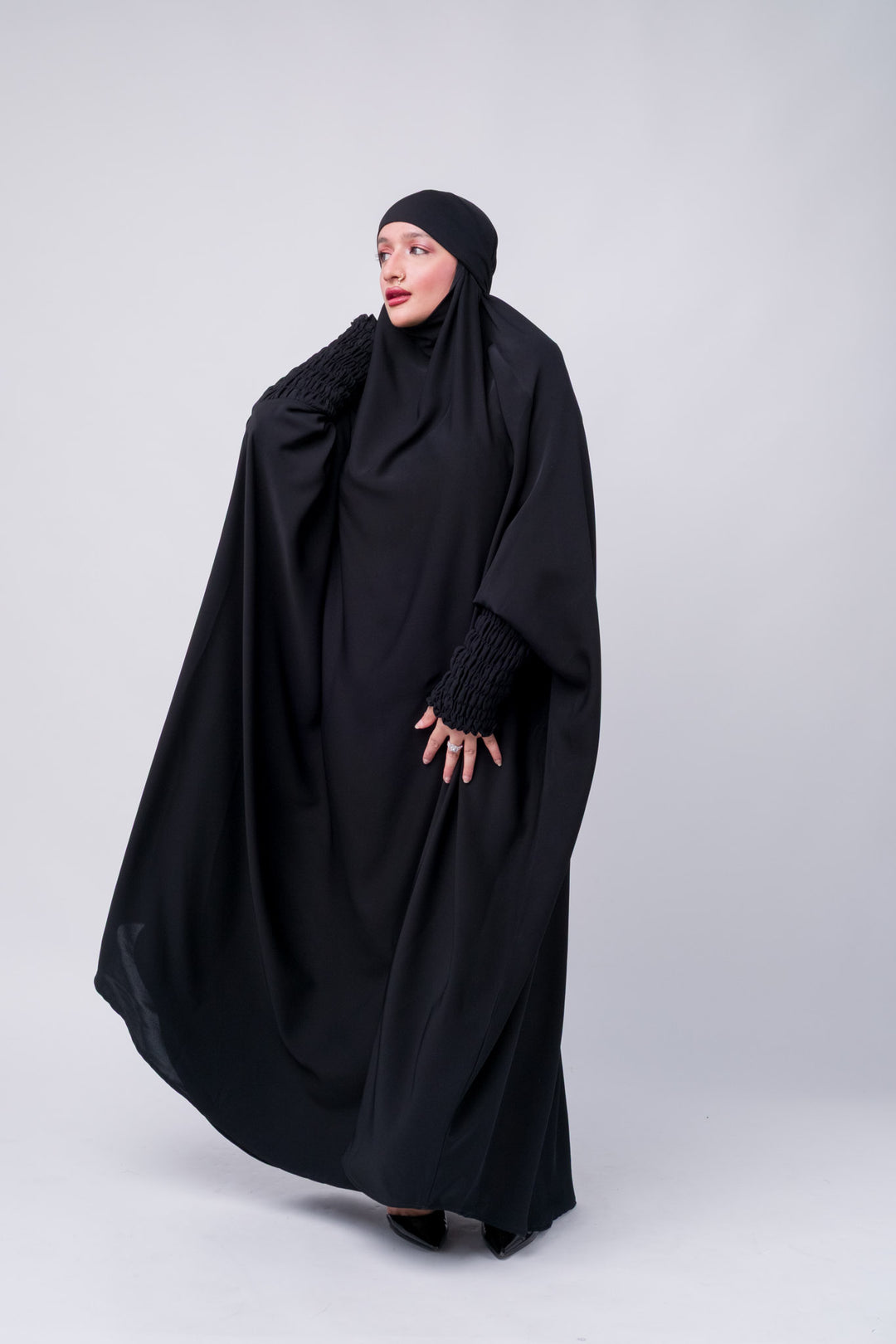 Elegant black prayer abaya with cuffed ruched sleeves, ideal for conservative modest fashion style.