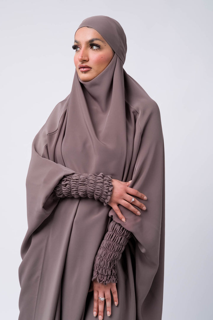 One-piece taupe jilbab with elastic ruched sleeves, modest Muslim prayer outfit for daily use.