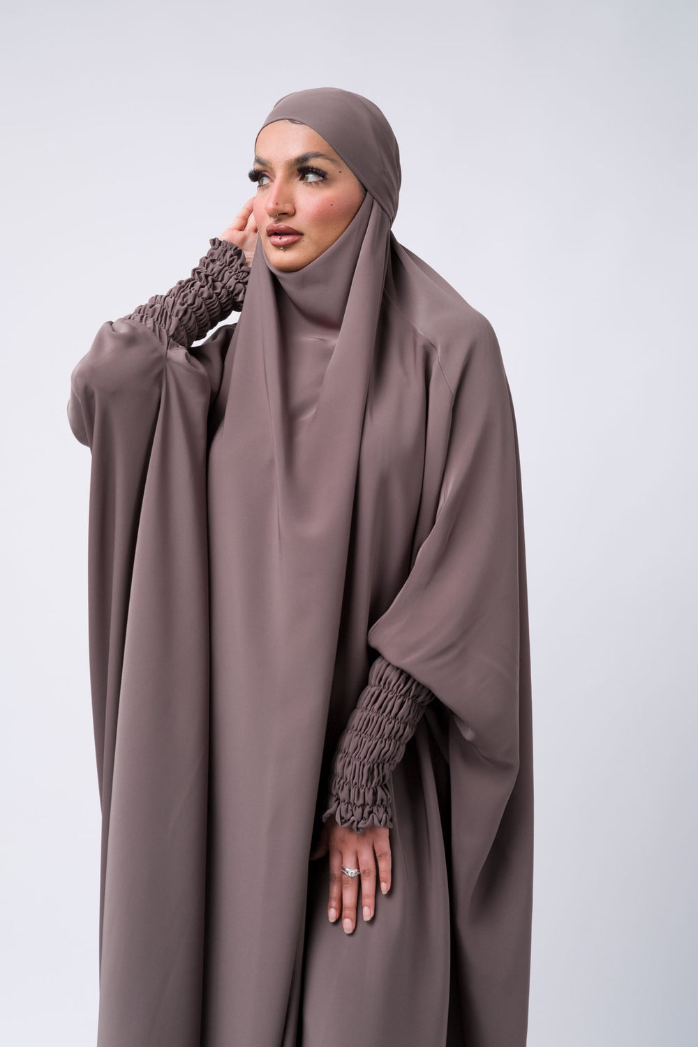 Modest one-piece khimar jilbab with stretch smocked sleeves in taupe, breathable and stylish for Muslim women.
