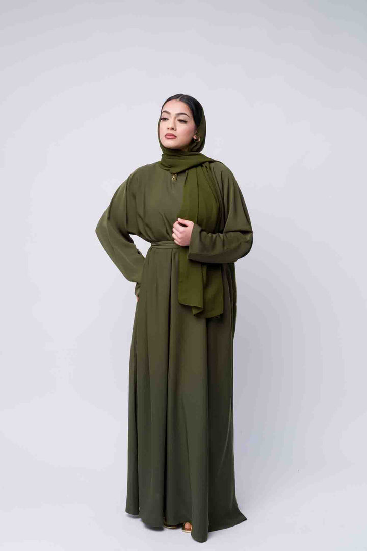 Chic green abaya with hijab for women, breathable and modest Islamic fashion outfit.