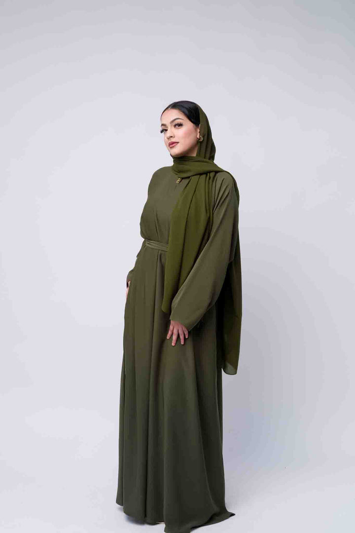 Premium olive abaya for Muslim women, featuring long sleeves and a flowy design. 
