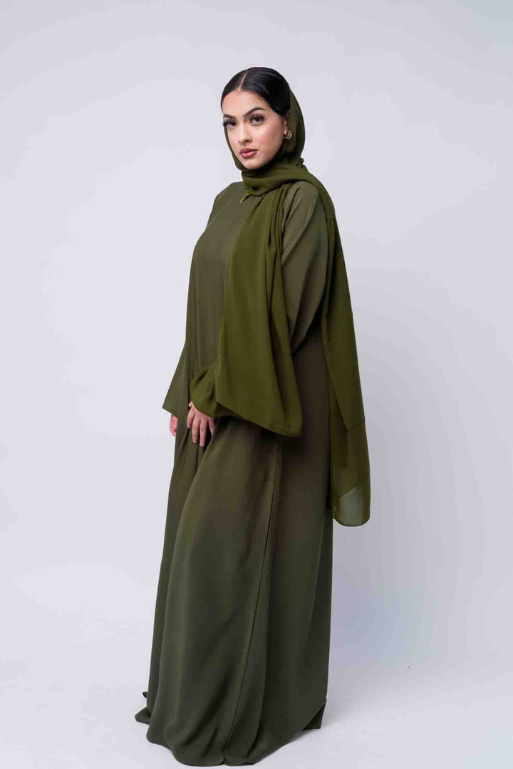 Stylish olive green abaya for women, includes matching hijab for complete modest look. 