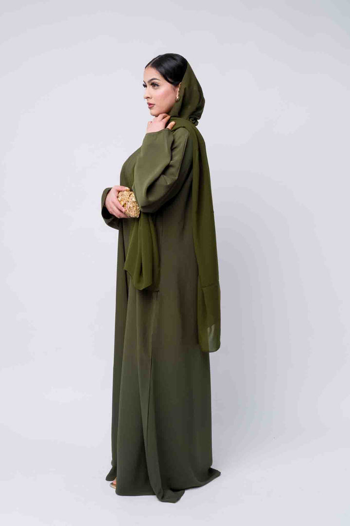 Long sleeve olive abaya dress with soft fabric, classic and stylish modest wear. 