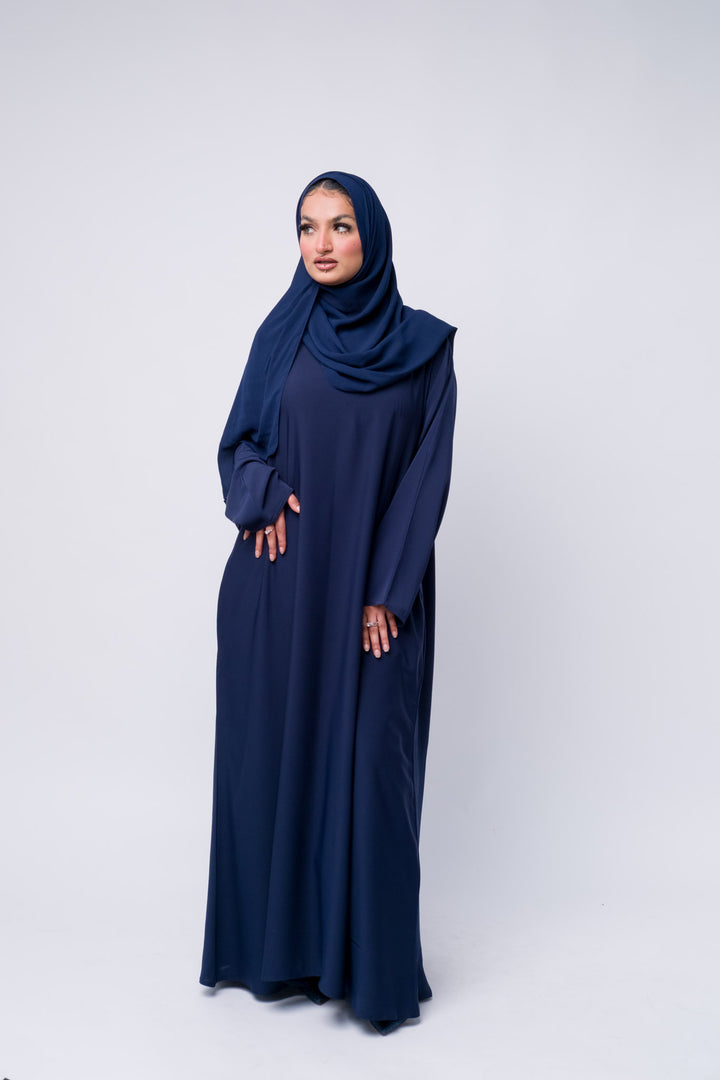  Lightweight navy abaya for women, modest Islamic clothing with loose fit and long sleeves.