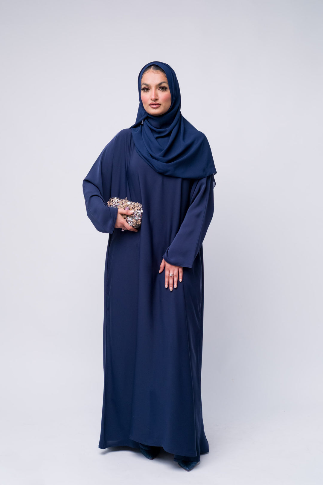  Modest navy blue abaya for women with hijab, elegant full-length Islamic dress for formal and daily wear. 