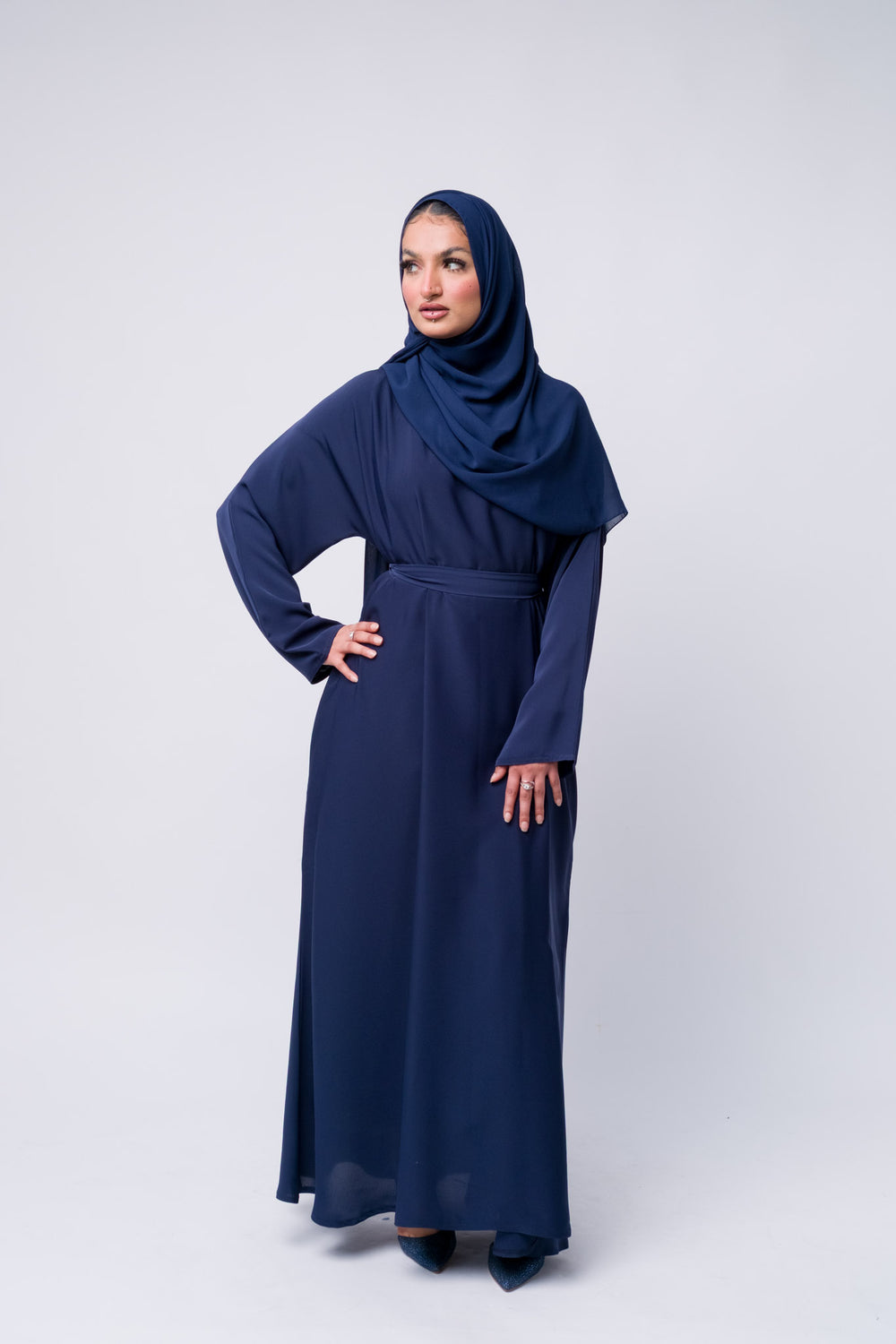 Stylish dark blue abaya with matching hijab, long sleeve modest wear for Muslim women.