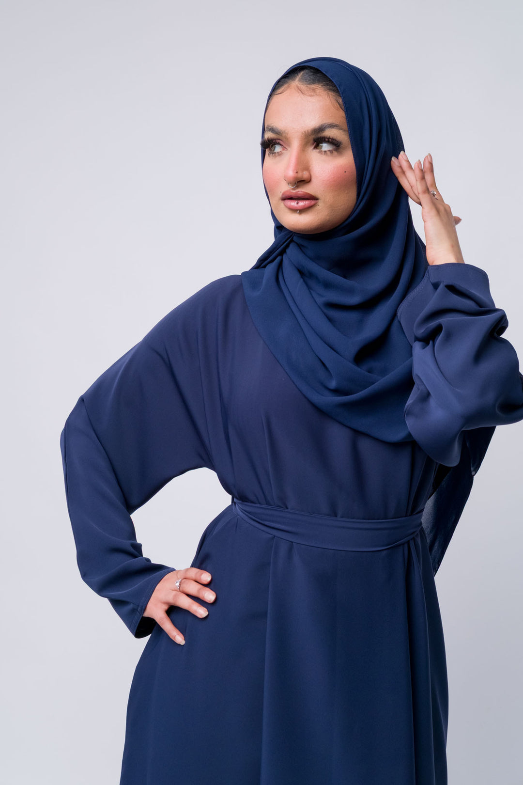 Modern navy blue abaya for women, full coverage Islamic outfit with elegant and modest design.