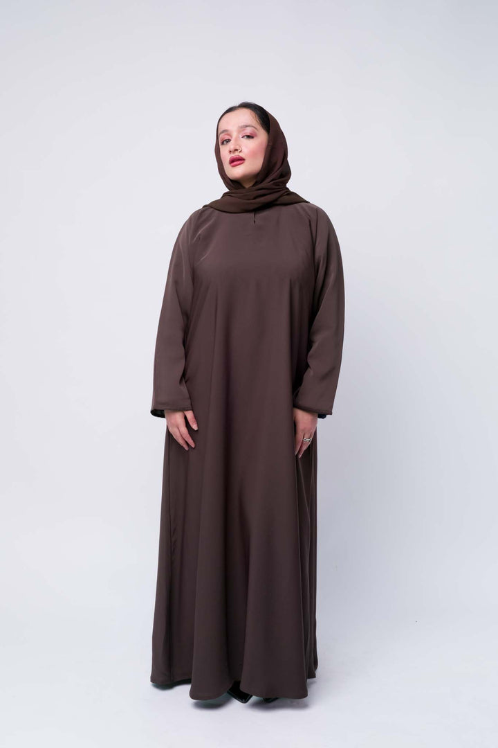  Stylish brown abaya dress with long sleeves, ideal for Islamic wear and formal occasions.