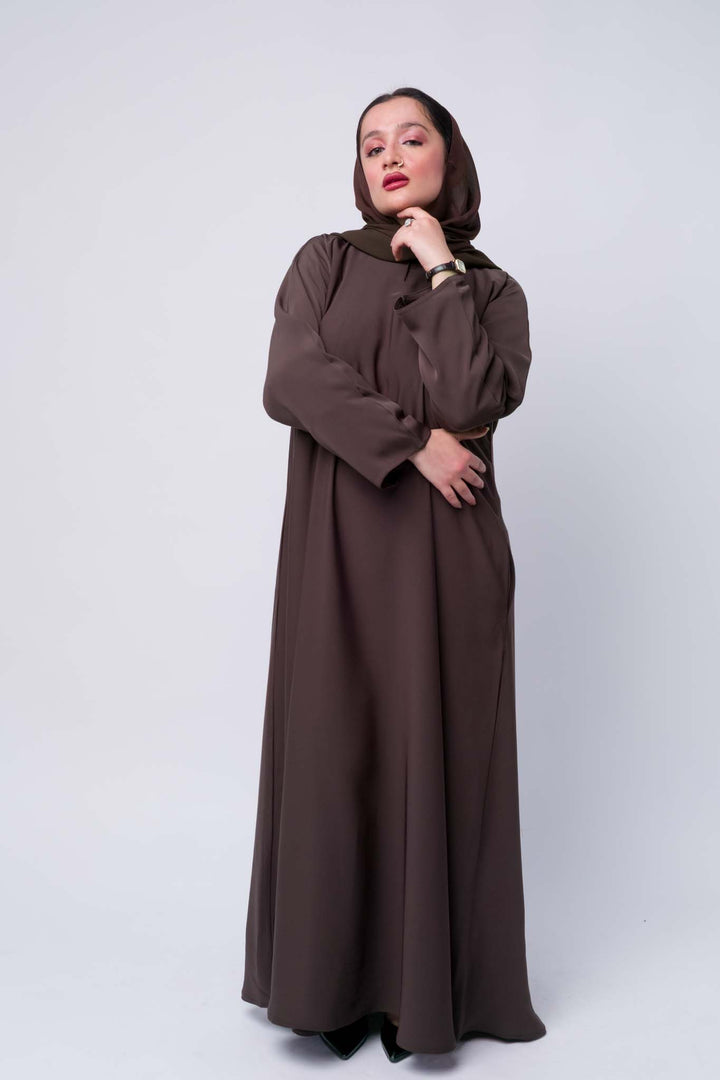 Classic brown abaya for Muslim women, perfect for daily wear, prayer, and gatherings.