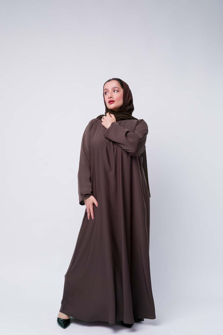 Chic brown abaya outfit with soft matching hijab, perfect for Eid and Islamic events. 