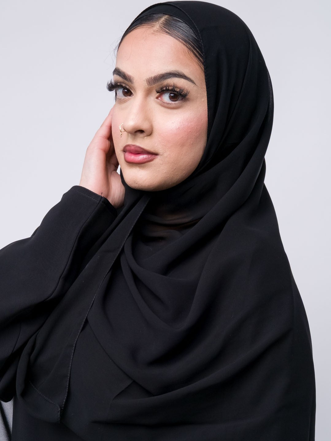 Premium Black chiffon hijab draped on mannequin – lightweight, elegant headscarf for Muslim women
