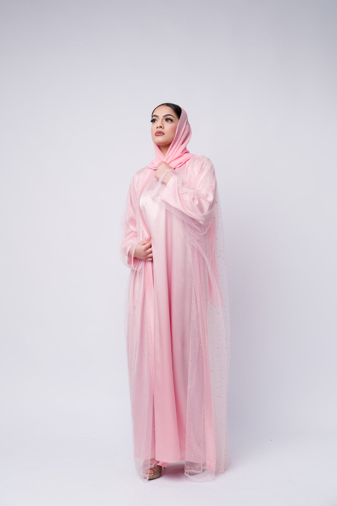 Modest pink satin abaya with sparkly chiffon overlay and scarf, perfect for Islamic events 