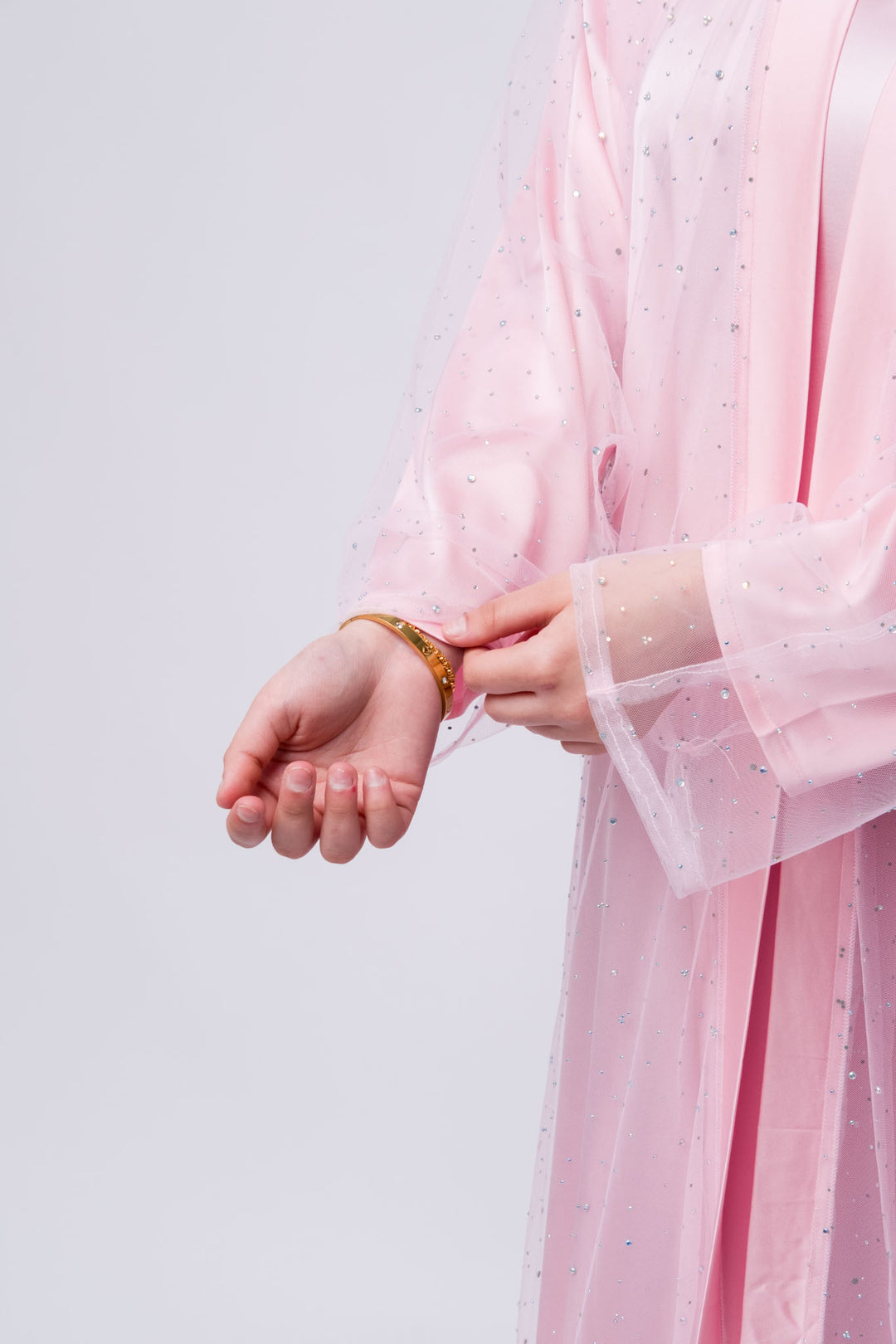 Feminine pink abaya gown with sparkly sheer overlay, perfect for modest evening dresses