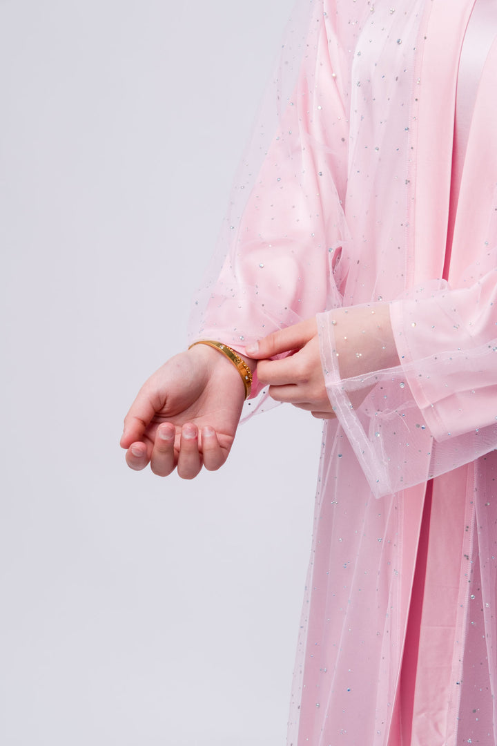 Feminine pink abaya gown with sparkly sheer overlay, perfect for modest evening dresses