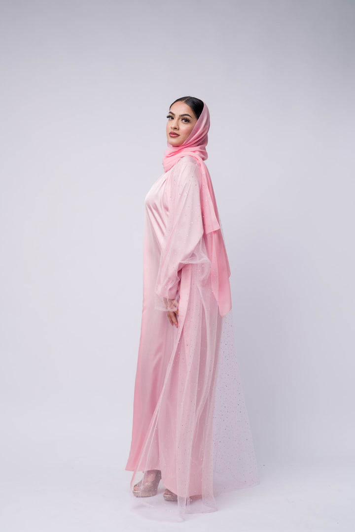 Glamorous pink formal abaya with sheer overlay and subtle sparkle for party or wedding wear