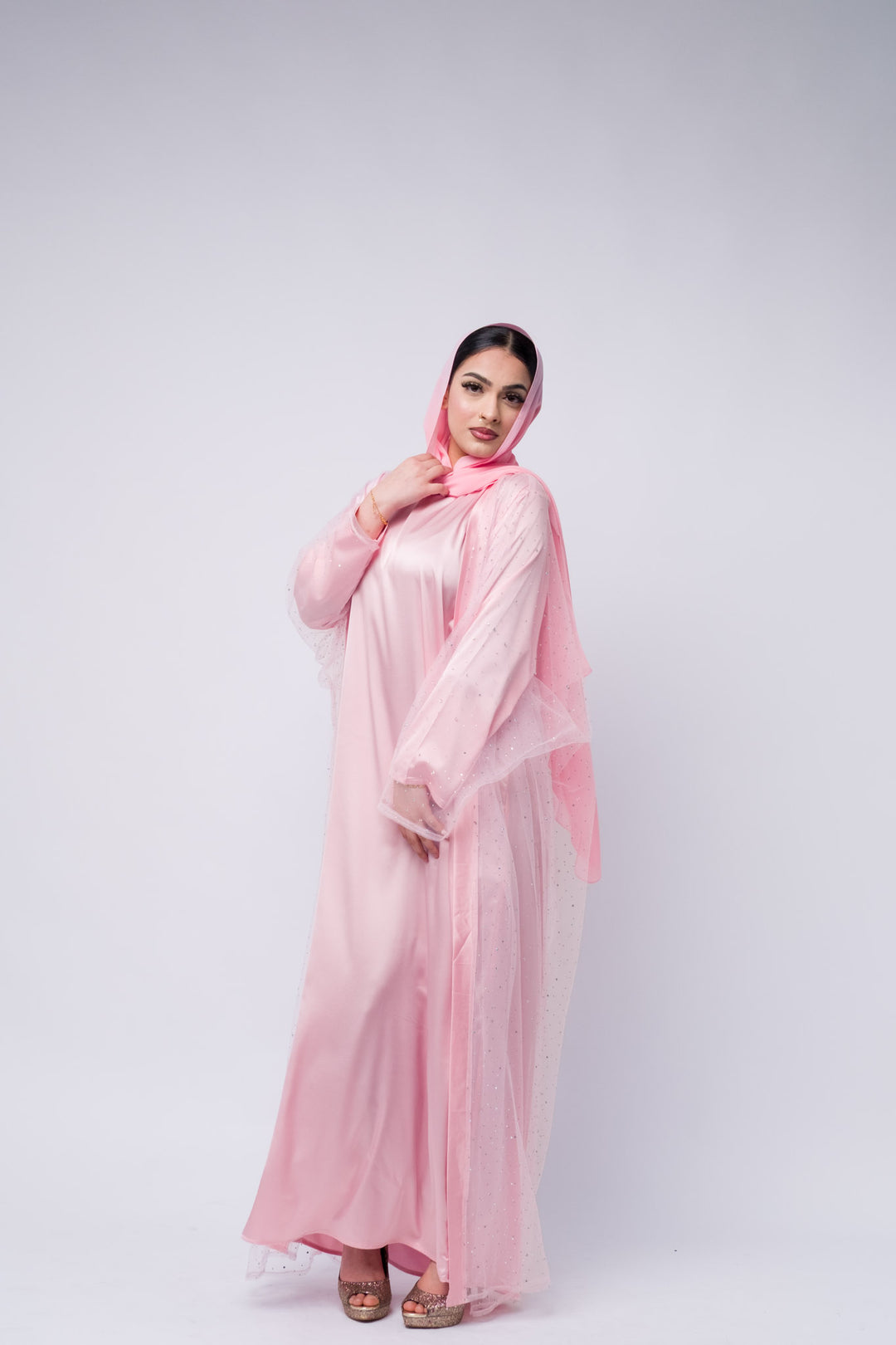 Crystal-detailed pink abaya with lightweight fabric and matching hijab for modern modest fashion
