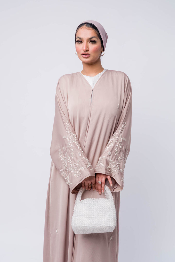 Premium nude open abaya with intricate beadwork, modest and elegant women’s outfit.