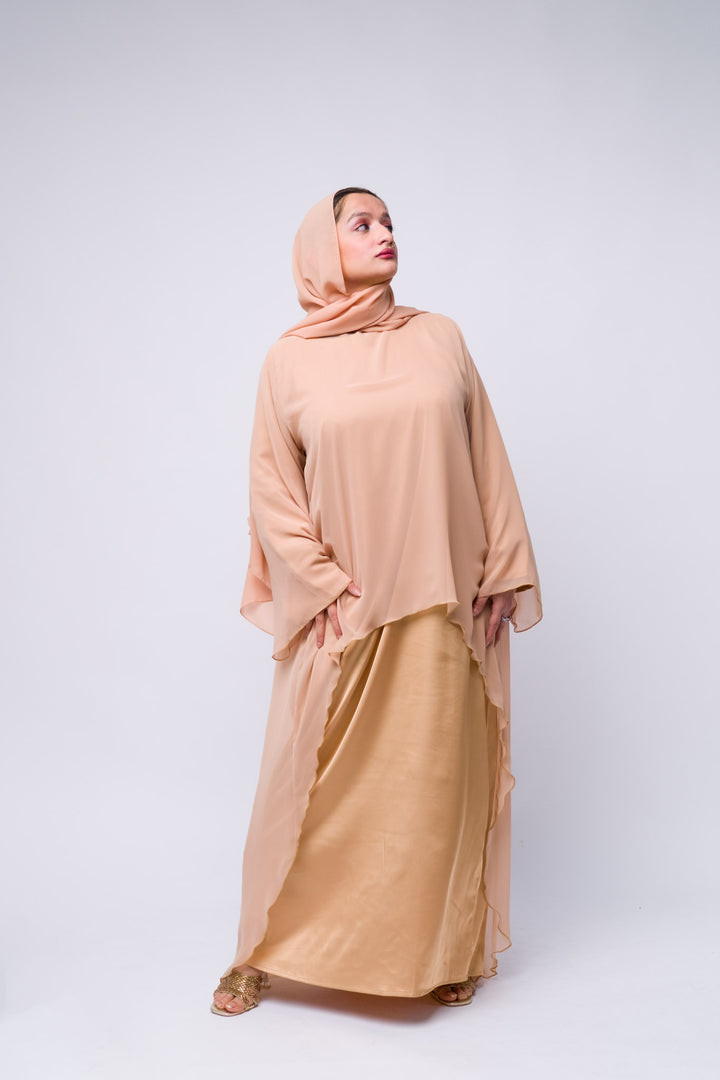 Two-tone peach abaya set with flowy chiffon outer and satin underlayer, modest wear. 