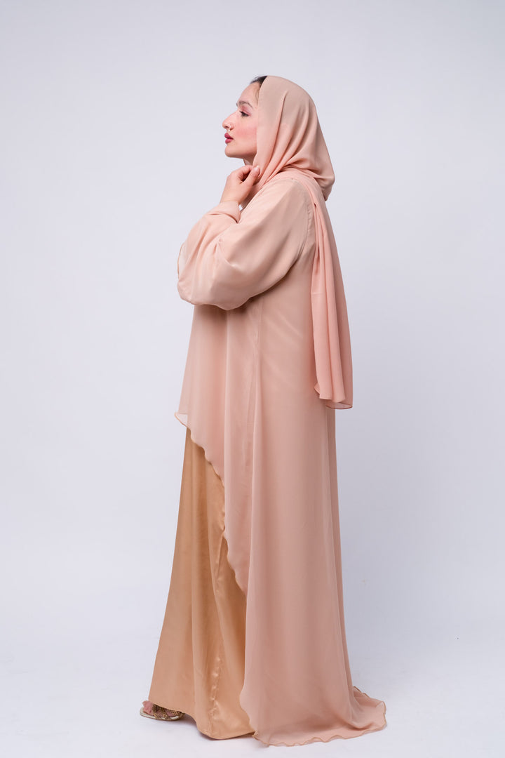 Elegant peach satin abaya dress with chiffon top layer, perfect for Eid or formal occasions.