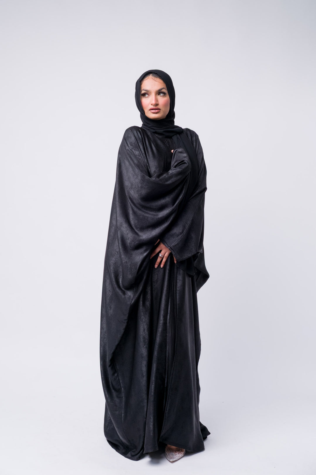 Premium black abaya dress with glossy texture and hijab, perfect for parties, Ramadan, or formal dinners.