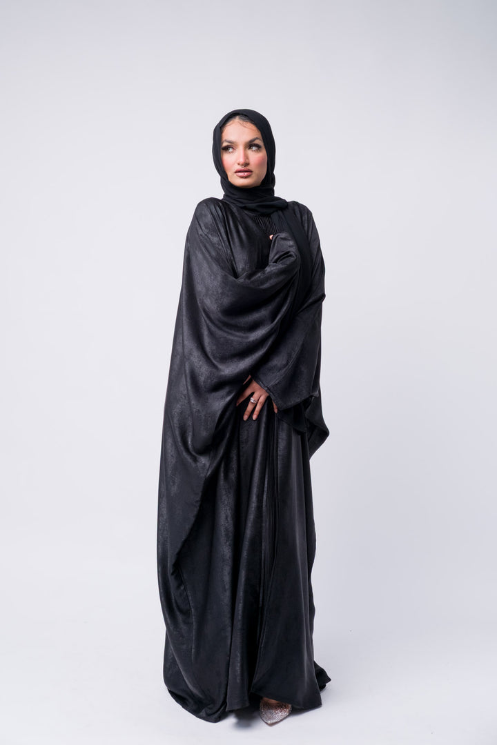 Premium black abaya dress with glossy texture and hijab, perfect for parties, Ramadan, or formal dinners.