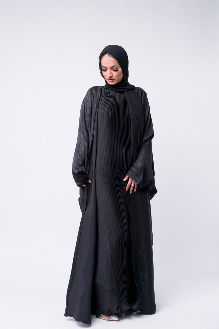 Elegant modest black abaya with shimmer finish and hijab, great for Eid, weddings, or everyday glam.