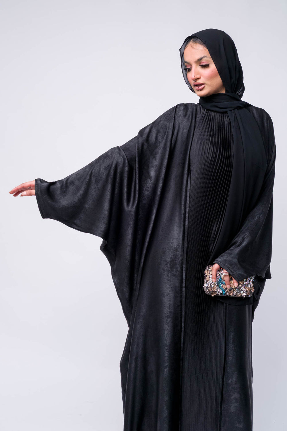  Classic black abaya for women with flowy design and matching hijab, great for Islamic fashion and events.