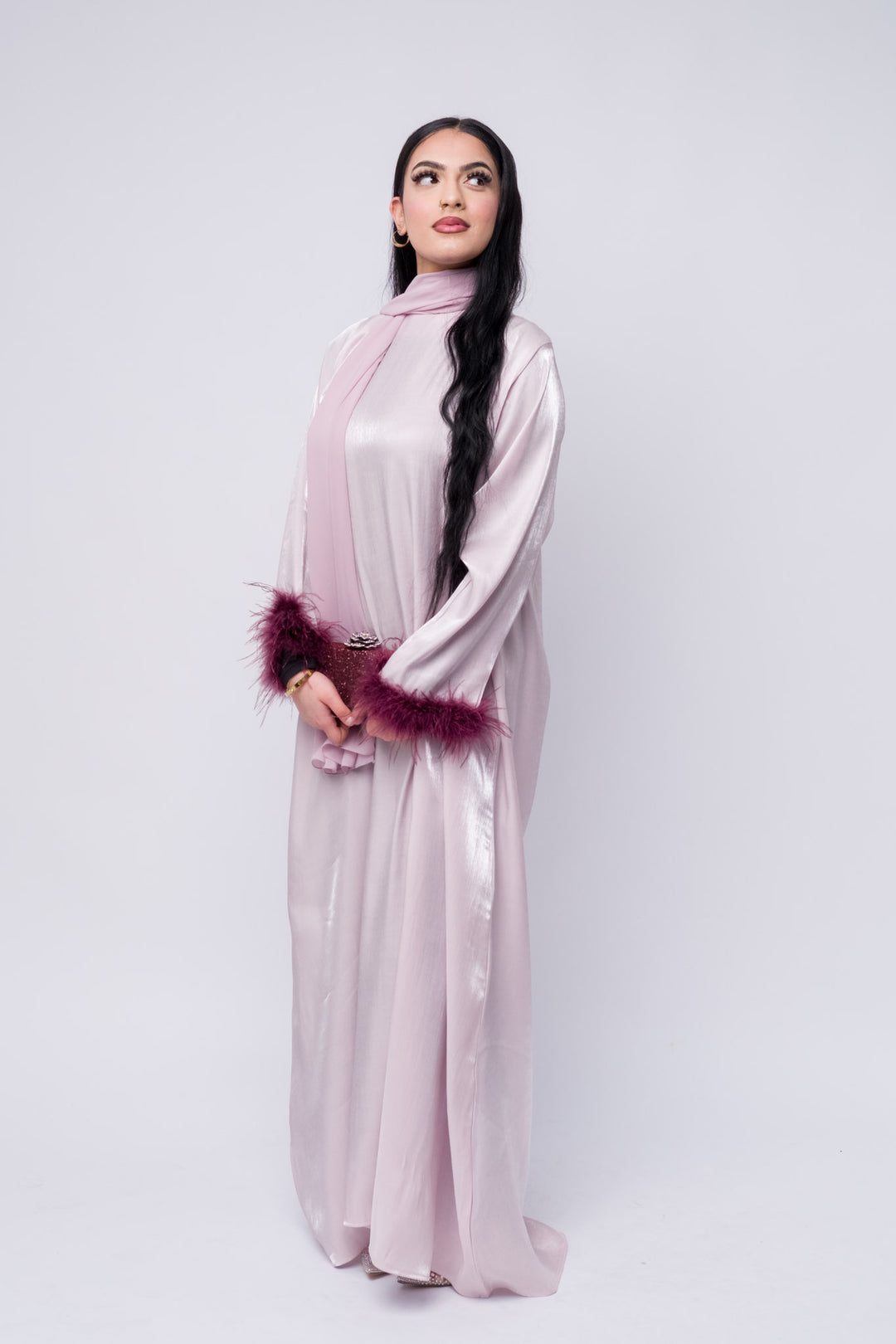 Feather-trim lilac satin abaya, soft sheen fabric, modest Islamic dress for special occasions.