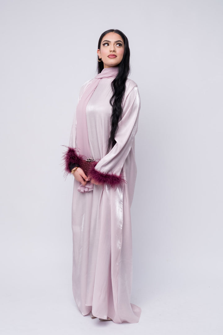 Feather-trim lilac satin abaya, soft sheen fabric, modest Islamic dress for special occasions.