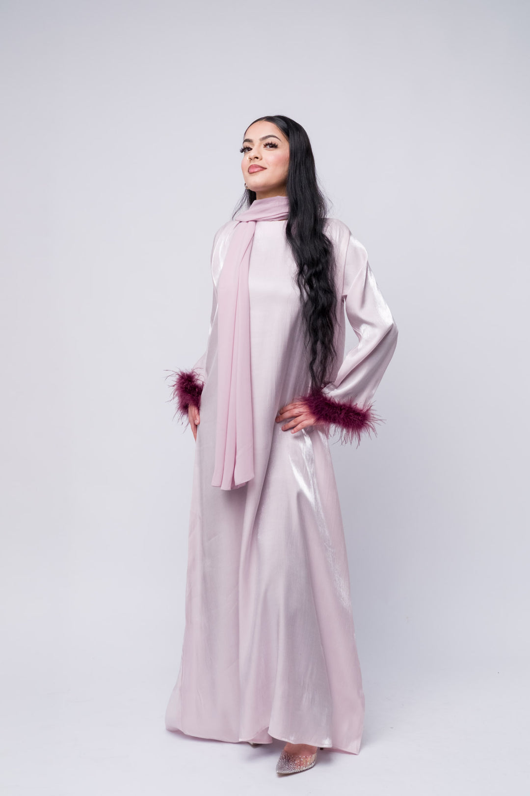 Stylish lilac abaya with purple feather details, luxury modest fashion, formal Islamic clothing.
