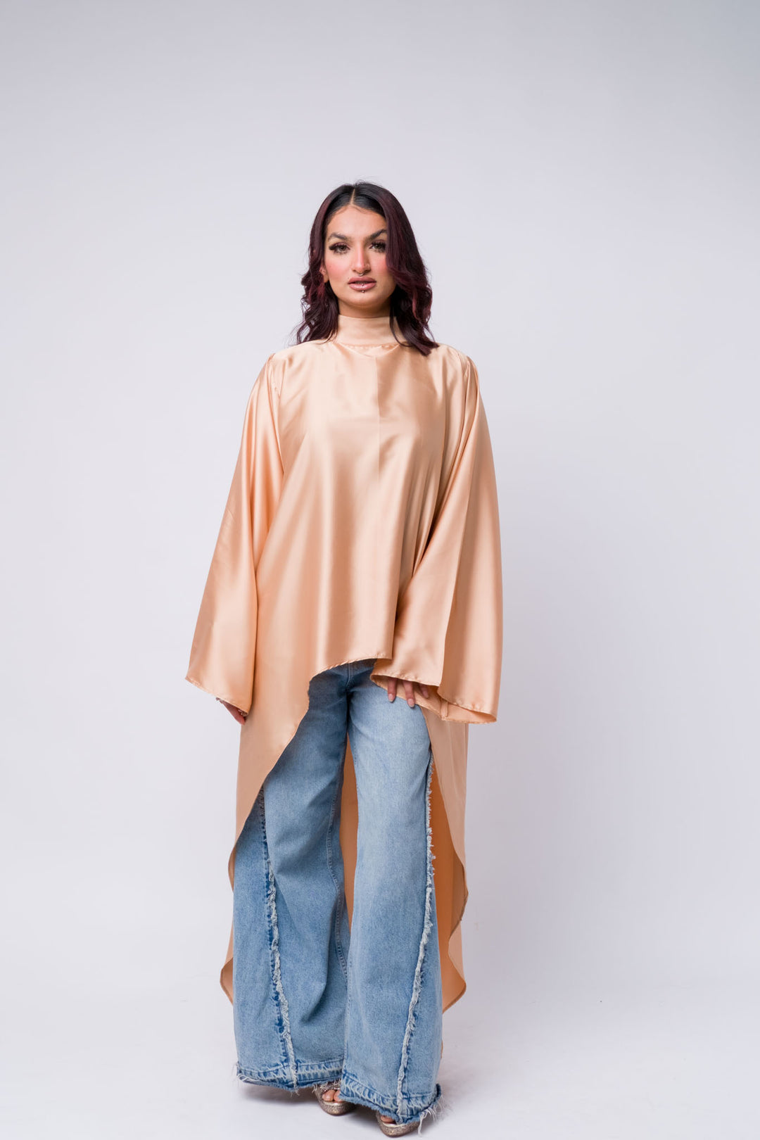 Satin peach asymmetrical top with wide-leg denim jeans – modest casual fashion 