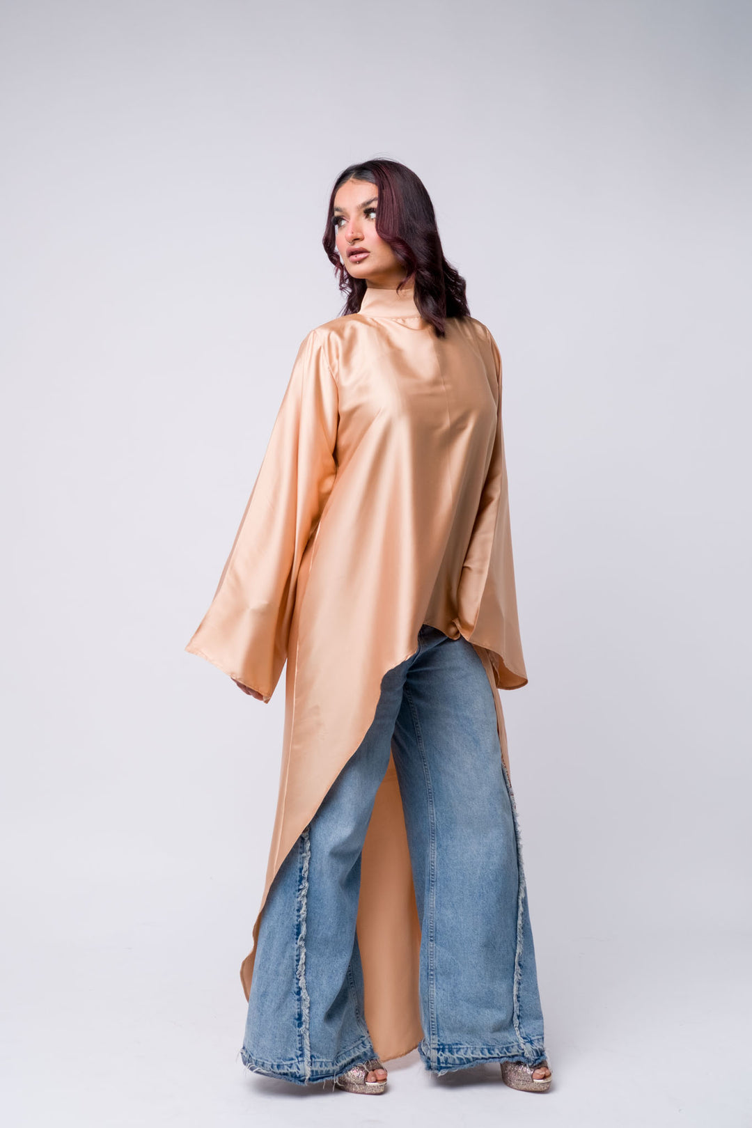 Long peach satin tunic with distressed jeans – modest street style for women